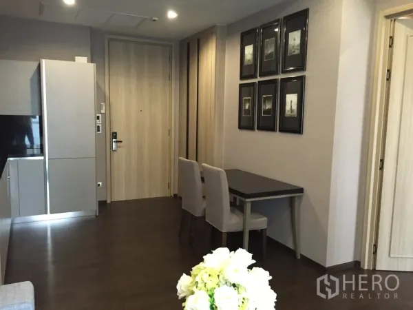 Condominium for rent in Watthana, Bangkok - Entry hall with built-in cabinetry and a compact dining or work table in a Watthana condominium.