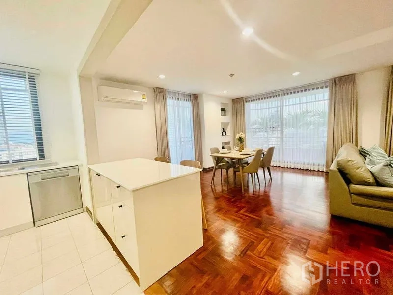 Condominium for rent - Kitchen island with storage facing dining and lounge.