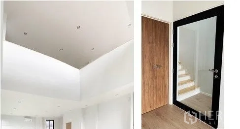 Home Office for rent in Don Mueang, Bangkok - Double-height ceiling with recessed lights and a glass door beside the staircase.