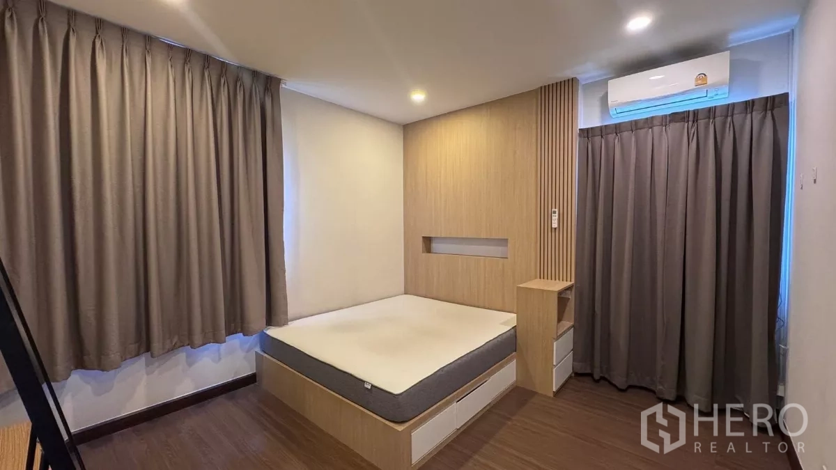 Detached House for rent or sale in Saphan Sung, Bangkok - Another angle of the same bedroom highlighting platform storage bed, wide curtains and ceiling lights.