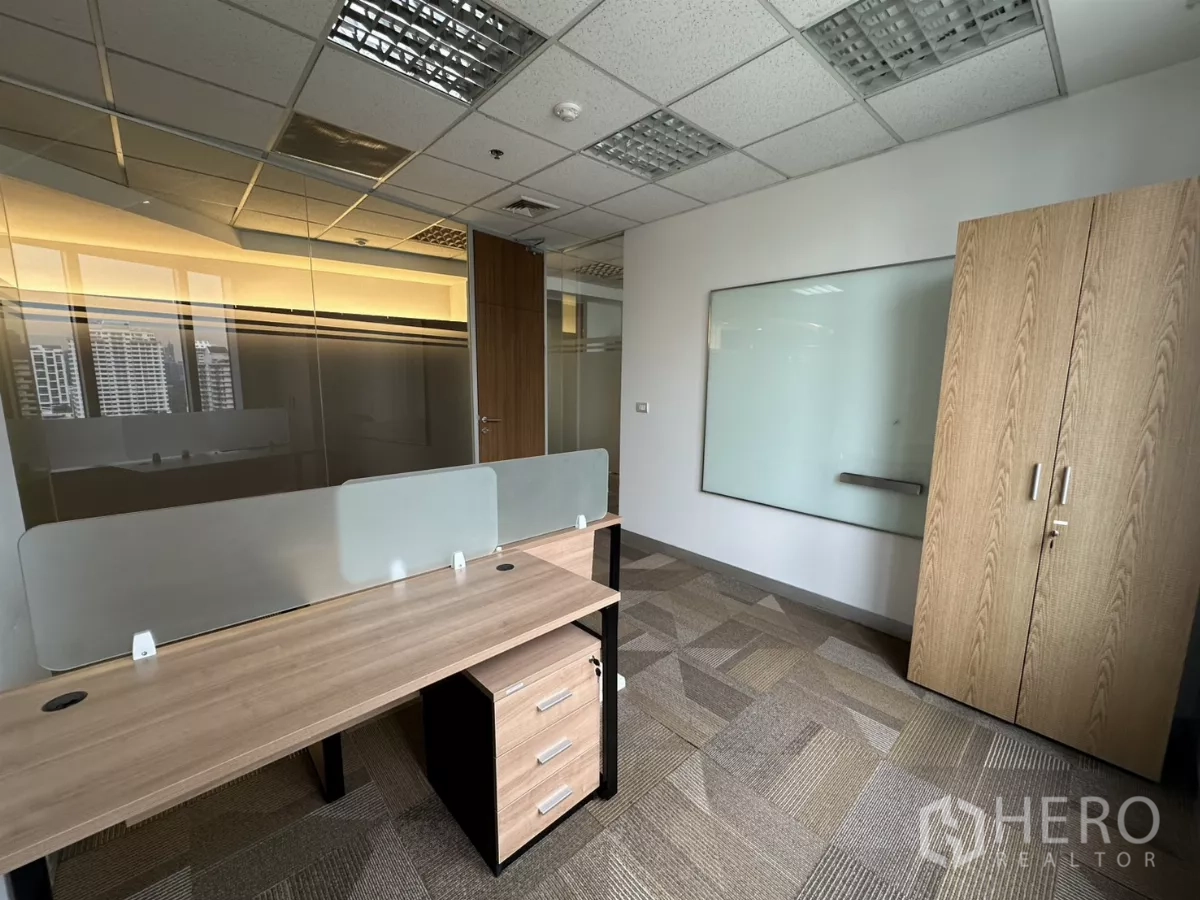 Office Space for rent in Watthana, Bangkok - Private office with desk, whiteboard, storage cabinet and glass wall.