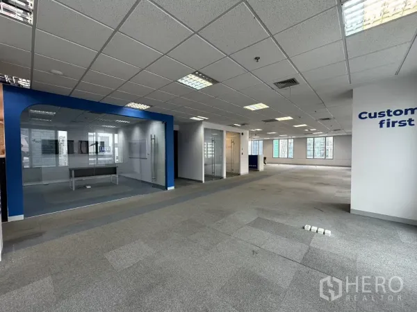 Office Space for rent in Watthana, Bangkok - Flexible office floor with multiple glass conference rooms and grey carpet.