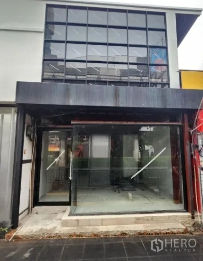 Retail Space for rent in Khlong Toei, Bangkok - Modern retail facade with full-width glass and metal awning ready for tenant fit-out.