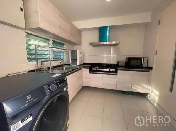 Detached House for rent in Lat Krabang, Bangkok - Fitted kitchen with gas hob, range hood, cabinets, sink and front-load washer