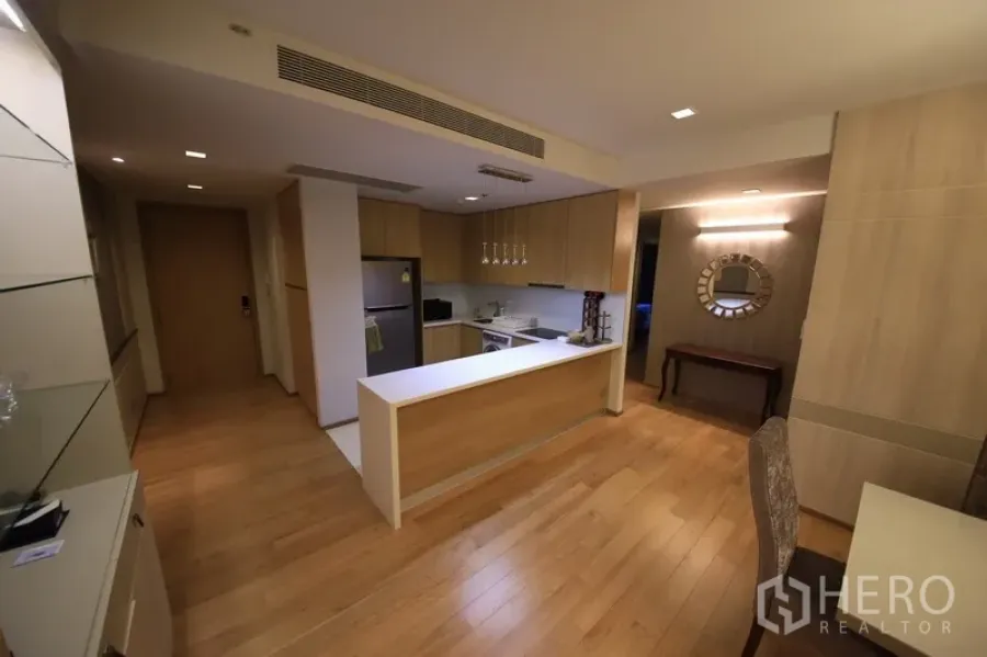 Condominium for rent in Watthana, Bangkok - Open-plan kitchen with wood cabinets, long island and hardwood floors