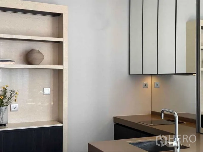Condominium for rent in Pathum Wan, Bangkok - Kitchen-to-living view with pendant lights, expansive glazing and skyline panorama.