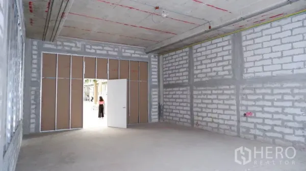 Retail Space for rent in Khlong Toei, Bangkok - Open retail interior showing wide entrance and block walls ready for custom fit-out.