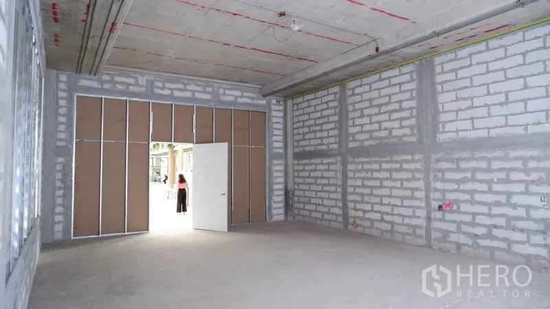 Retail Space for rent in Khlong Toei, Bangkok - Open retail interior showing wide entrance and block walls ready for custom fit-out.
