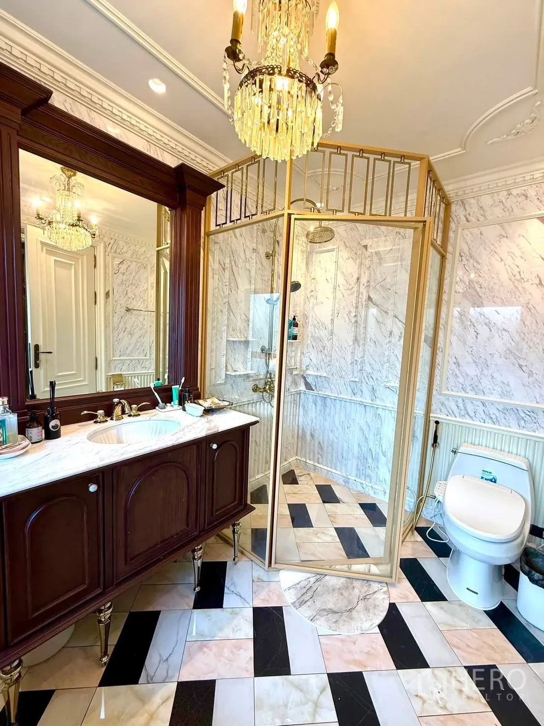 Detached House for rent in Bang Kapi, Bangkok - Bathroom with gold-framed glass shower, marble vanity, and toilet.