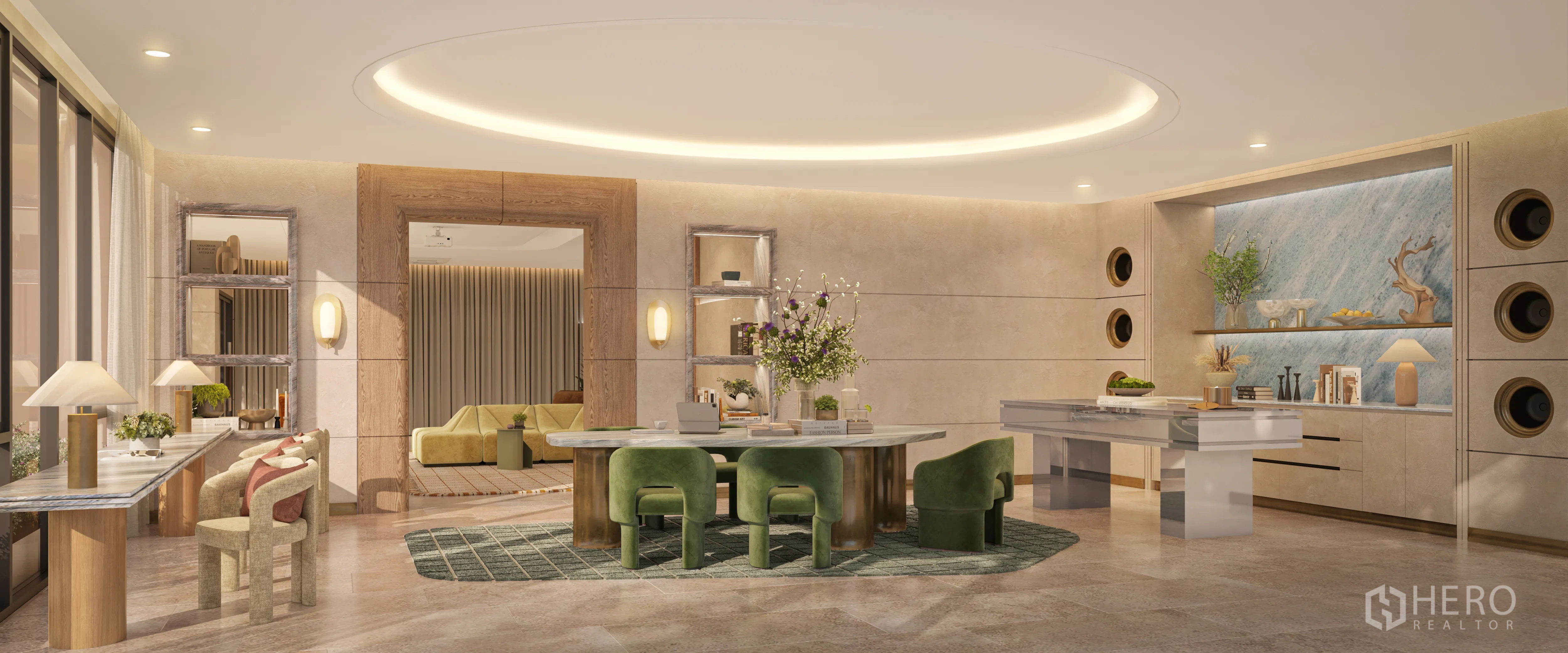 Condominium for sale in Watthana, Bangkok - Elegant resident lounge with oval ceiling light, round stone table, green chairs, built-in shelving, work counters, and large windows in a modern condominium.