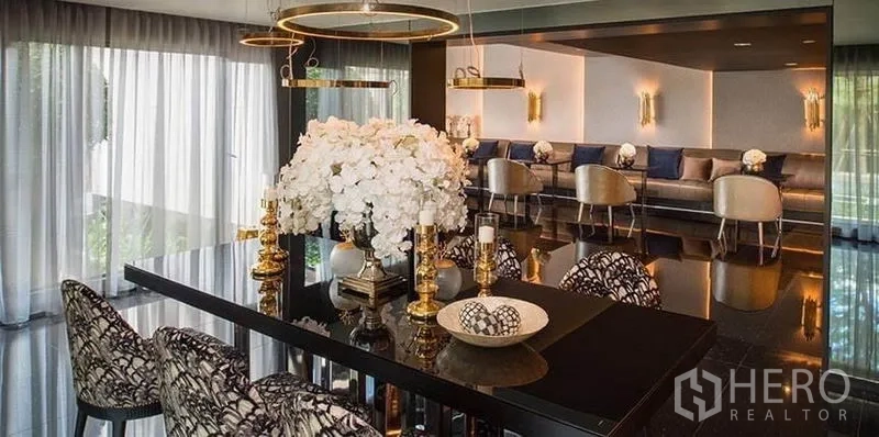 Condominium for rent in Khlong San, Bangkok - Private dining or function room with glossy table, floral centerpiece, and ring lights.