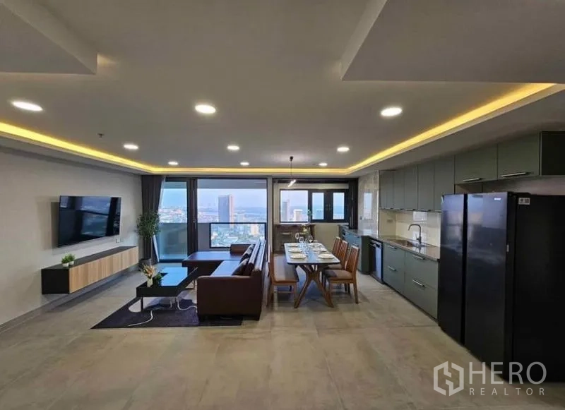 Condominium for rent or sale - Wide shot of open living, dining and kitchen with balcony views.