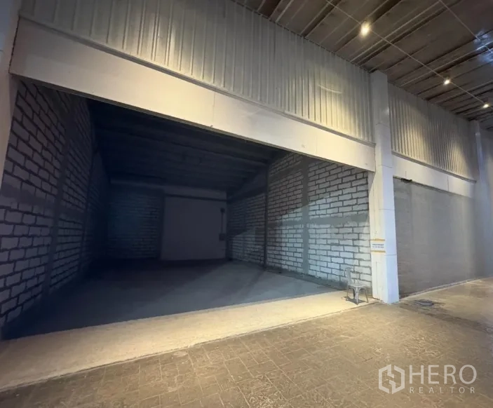 Retail Space for rent - Wide shop bay with high ceiling under covered arcade, unfinished brick walls ready for fit-out