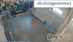 Warehouse for rent in Mueang Pathum Thani, Pathum Thani - Generator room with industrial diesel generator and electrical panels.