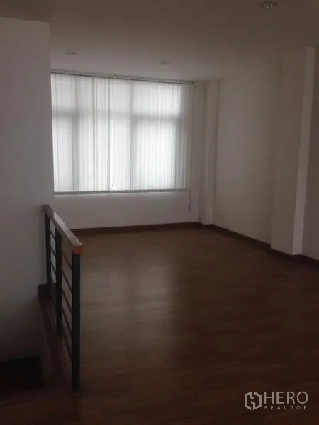 Home Office for rent in Bang Phli, Samut Prakan - Top-floor landing with big window and sheer blinds.