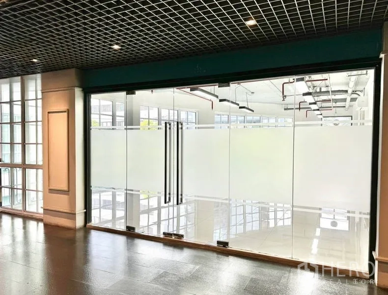 Office Space for rent in Khlong Toei, Bangkok - Modern office facade with floor-to-ceiling glass and frosted partition