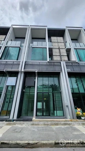 Home Office for rent - Modern multi-storey home office facade with full-height glass and metal accents.