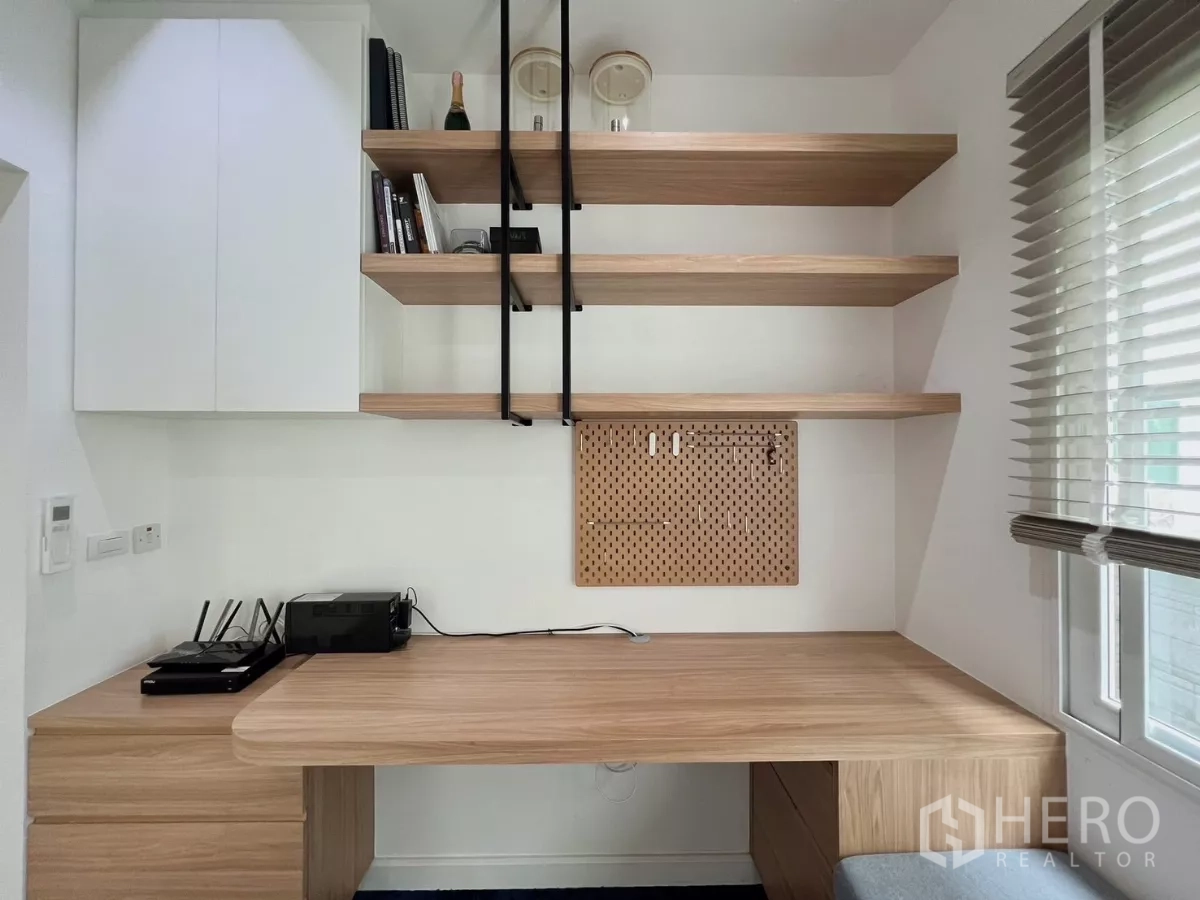 Detached House for rent or sale in Khlong Luang, Pathum Thani - Workspace close-up with pegboard, open shelves and large window.
