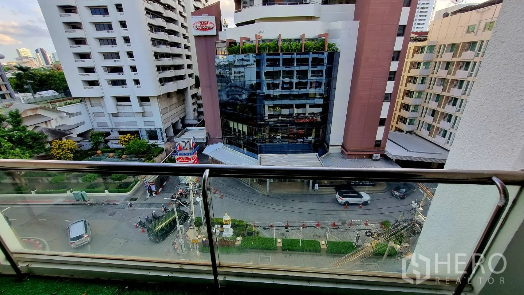 Condominium for rent in Watthana, Bangkok - Vanity with basin and framed mirror in a tiled bathroom.