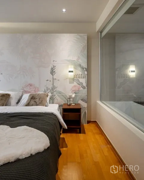 Condominium for sale - Bedroom corner with floral feature wall and glass window to ensuite bathroom.