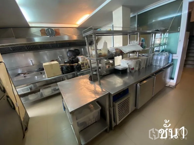 Shophouse for rent in Watthana, Bangkok - Prep kitchen with stainless benches, shelving and refrigeration units.