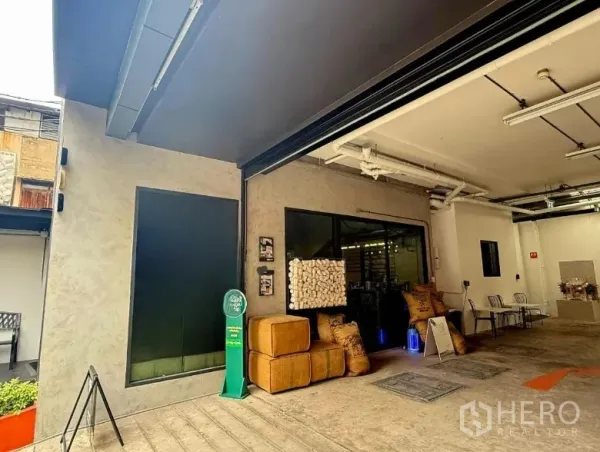 Retail Space for rent in Khlong Toei, Bangkok - Retail unit exterior under a covered forecourt with wide opening and space for seating or displays.