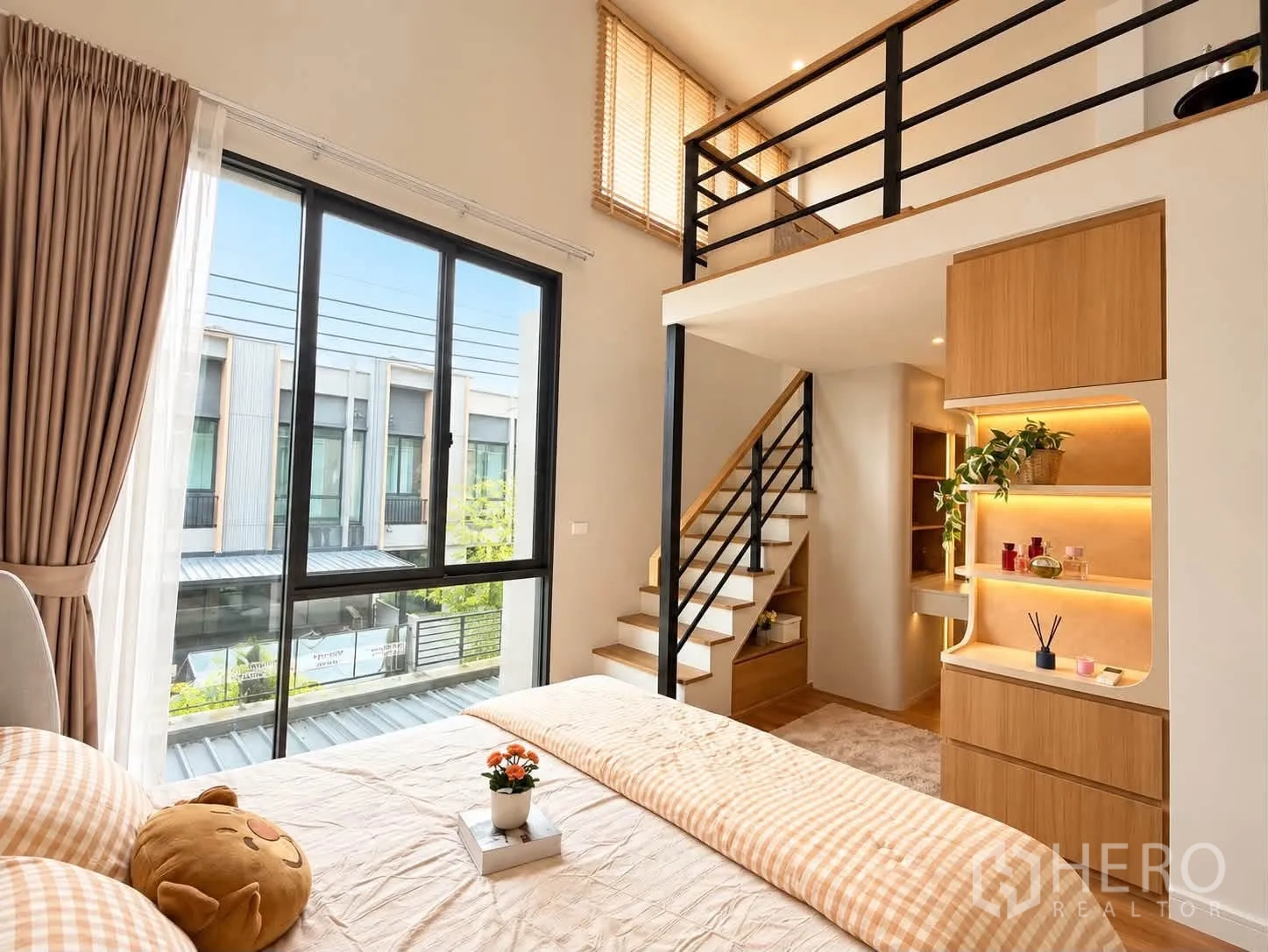 Townhouse for rent in Bang Phli, Samut Prakan - Master bed with illuminated wood panel headboard and bedside tables.