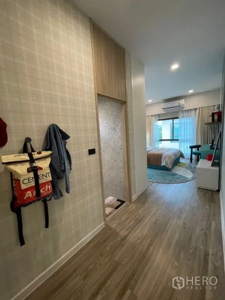 Detached House for sale in Bang Kapi, Bangkok - Modern bathroom with glass-enclosed shower, vanity and backlit mirror.