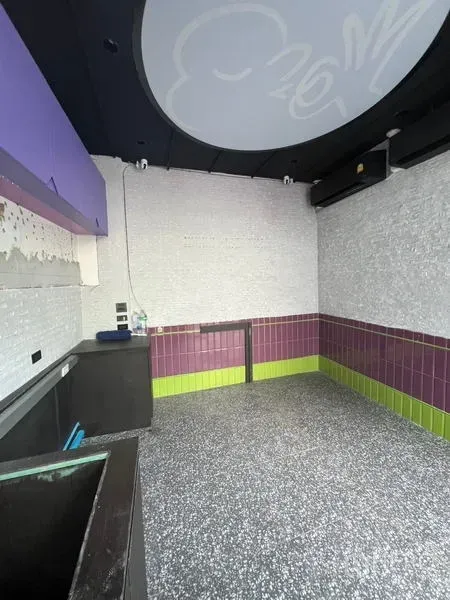 Retail Space for rent in Watthana, Bangkok - Open retail area with curved ceiling feature, colorful wall tiles, and space ideal for takeaway concepts.