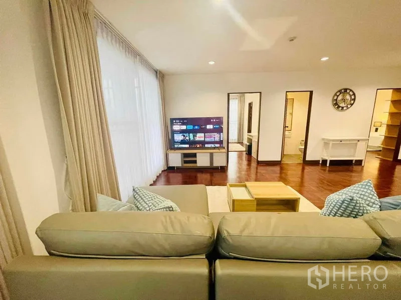 Condominium for rent - Living area view from sofa toward TV unit and hallway.