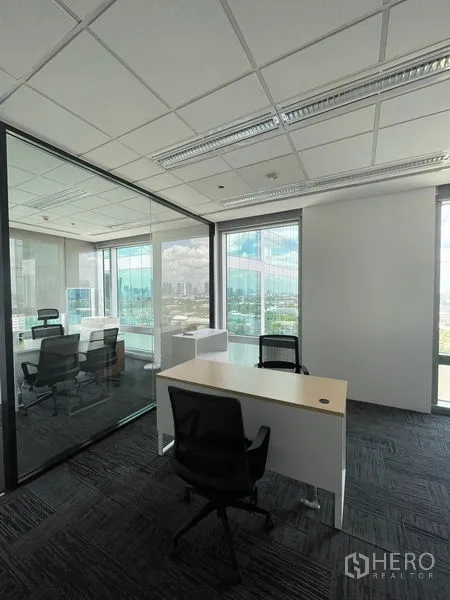 Office Space for rent in Dusit, Bangkok - Reception lounge with sofas and coffee table next to glass meeting rooms.