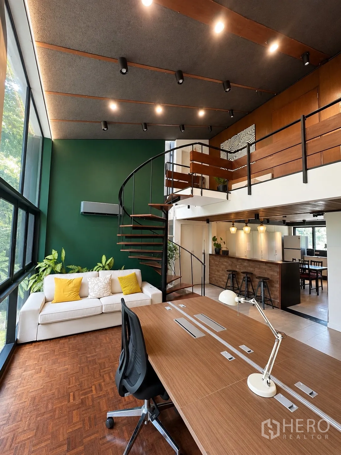 Office Space for rent in Phaya Thai, Bangkok - Loft-style workspace with large windows, wood desk, white sofa, and spiral stairs.