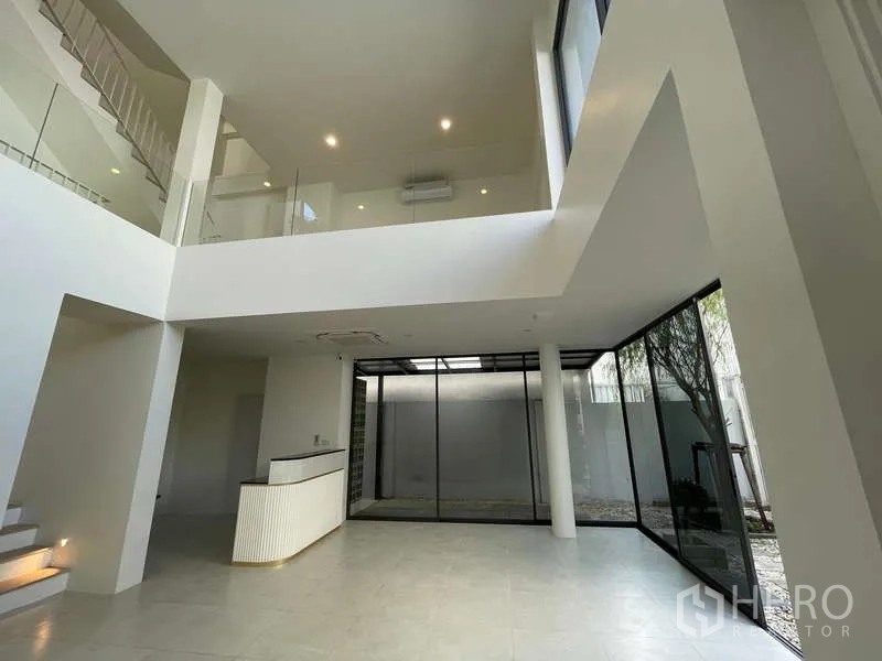 Home Office for rent in Don Mueang, Bangkok - Open-plan atrium with internal garden views and expansive glass walls.