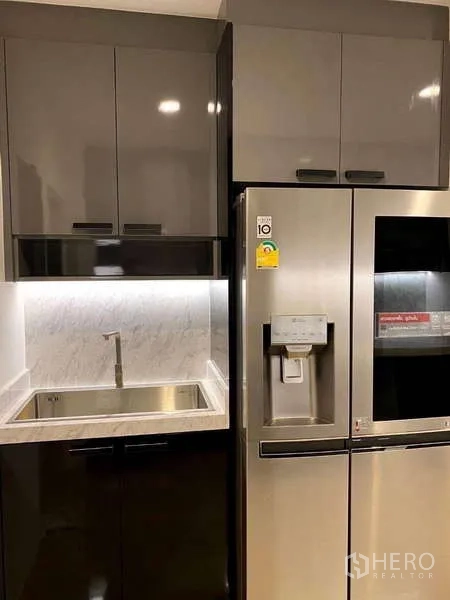 Detached House for rent - Pantry area with stainless sink, tall storage and side-by-side refrigerator with dispenser.
