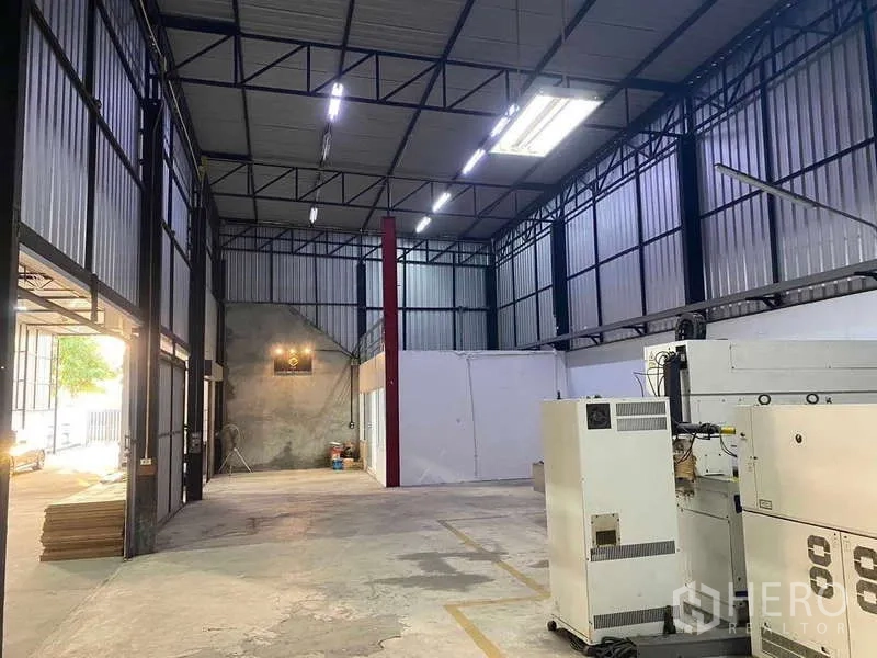 Warehouse for sale in Mueang Samut Prakan, Samut Prakan - Industrial workspace with partitioned office, bright LED lighting and power supply.
