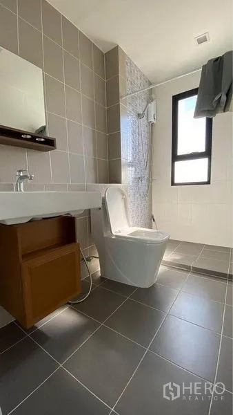 Retail Space for sale in Bang Na, Bangkok - Modern bathroom with walk‑in shower, window and neutral wall tiles.