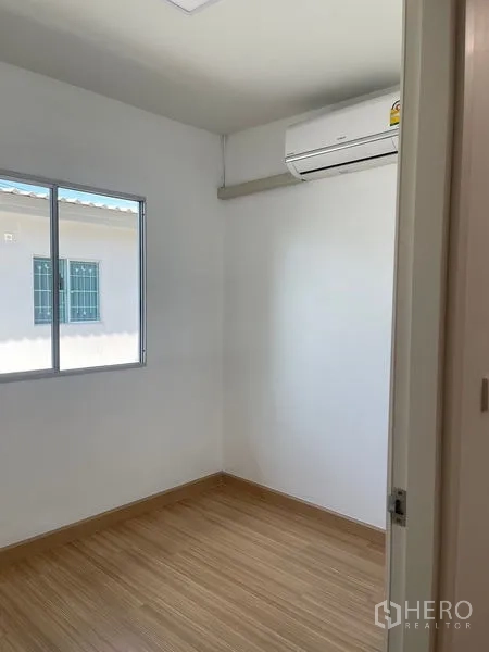 Townhouse for sale - Compact bedroom with air conditioner and window