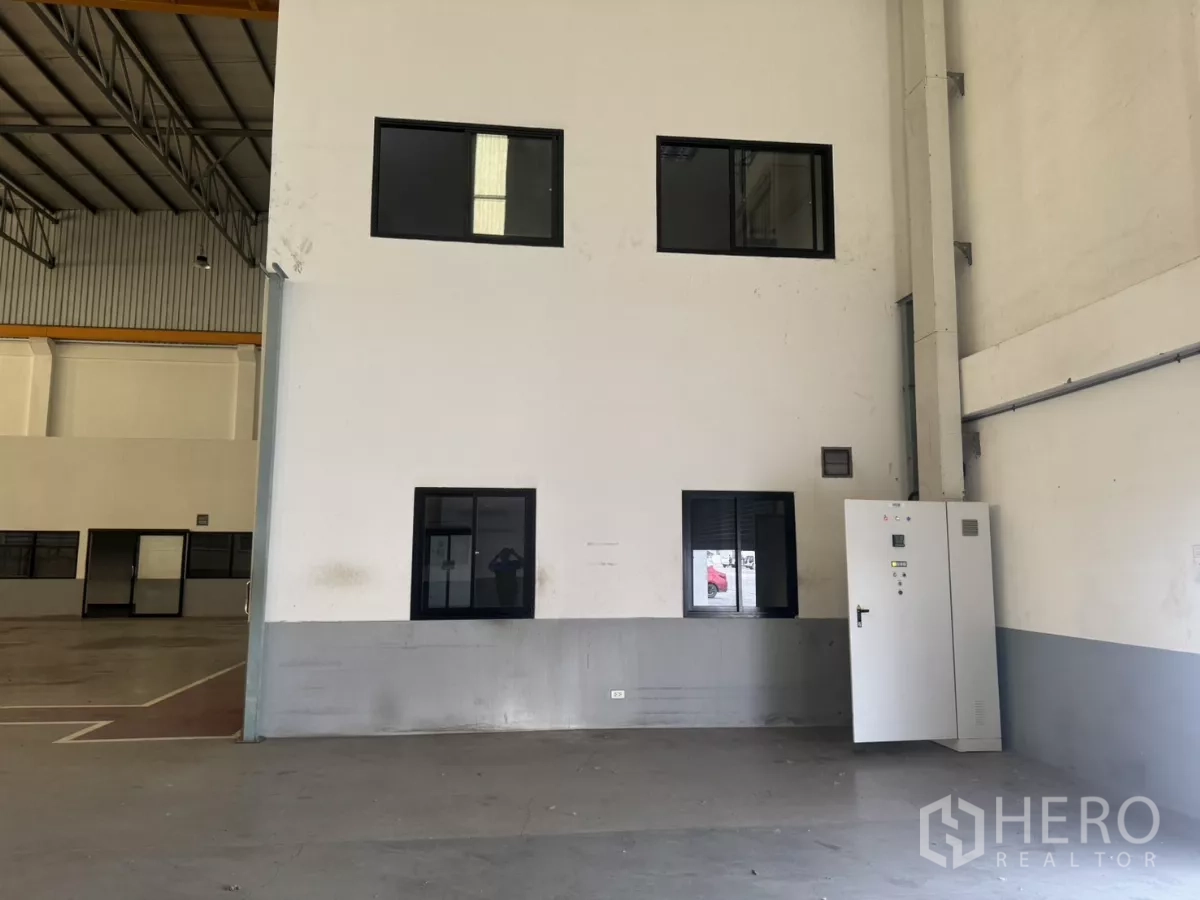 Factory for rent or sale in Bang Phli, Samut Prakan - Factory corner with electrical control cabinet and internal windows.