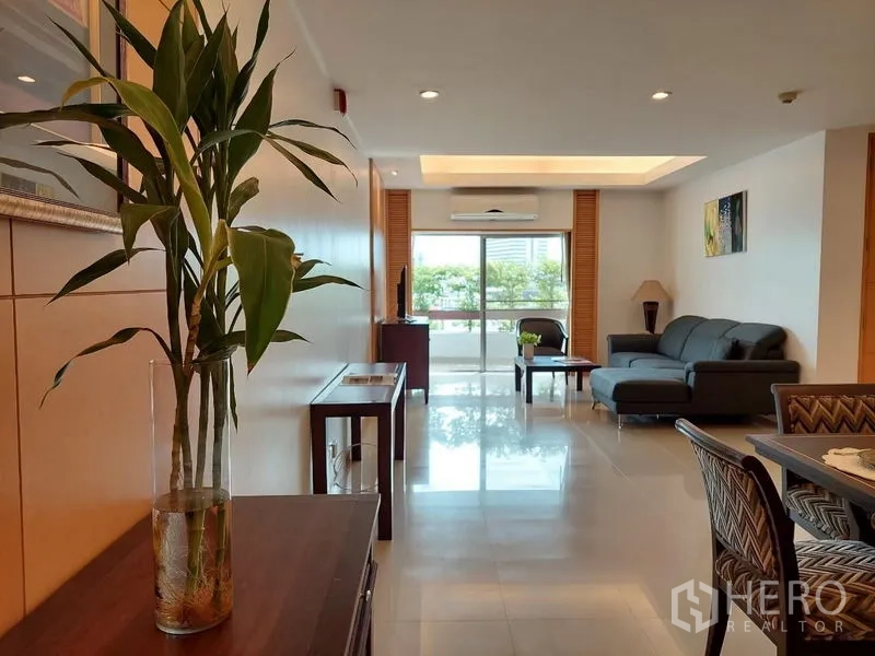 Apartment for rent - Open-plan view of dining and living areas with a balcony at the far end.
