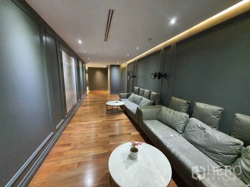 Office Space for rent in Watthana, Bangkok - Lounge corridor with sofa seating and wooden flooring for staff breaks.
