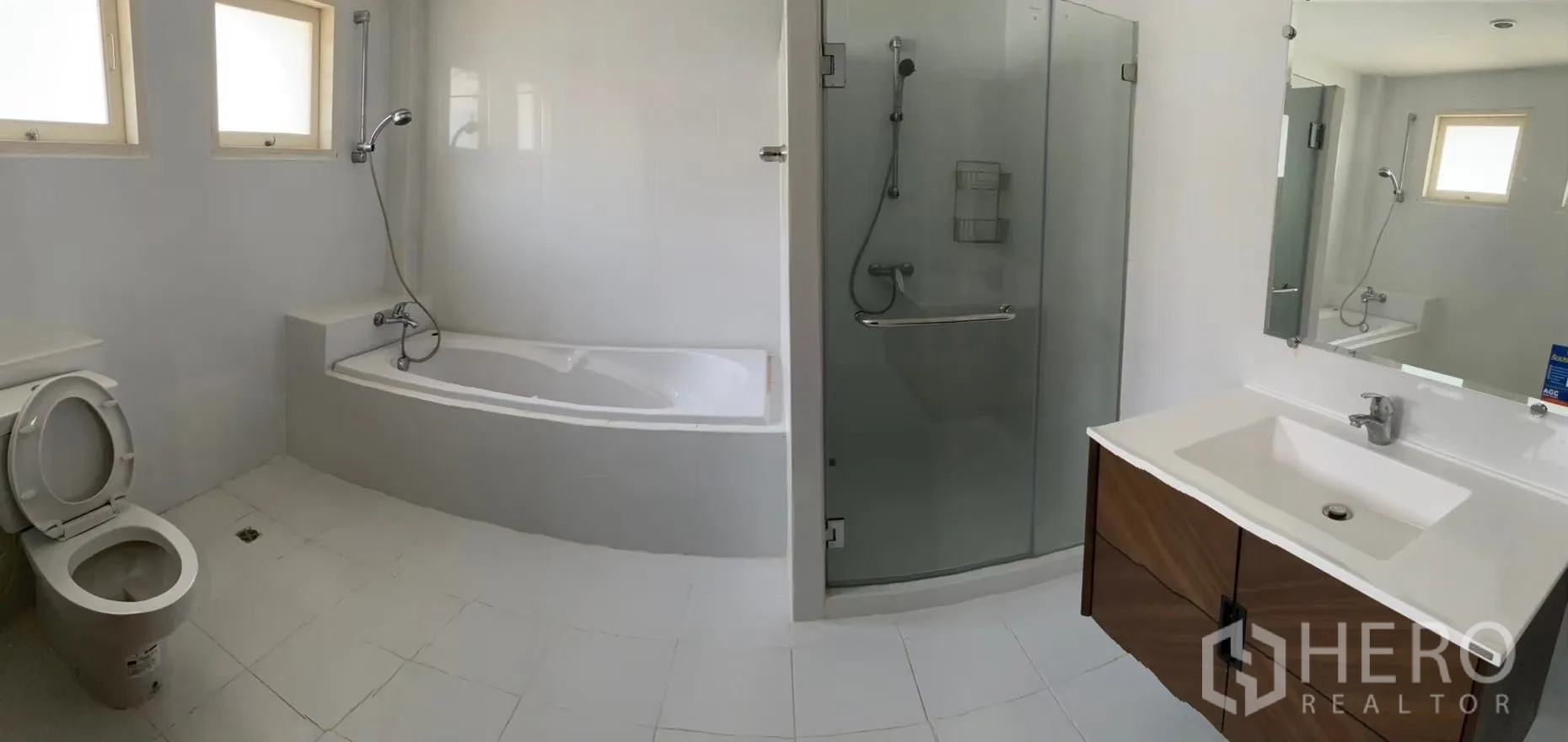 Detached House for rent in Watthana, Bangkok - Thai kitchen view with granite countertops and range hood.