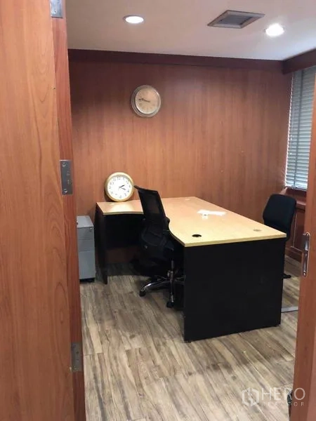 Office Space for sale in Watthana, Bangkok - Private office with wood walls, desk, and task chair.