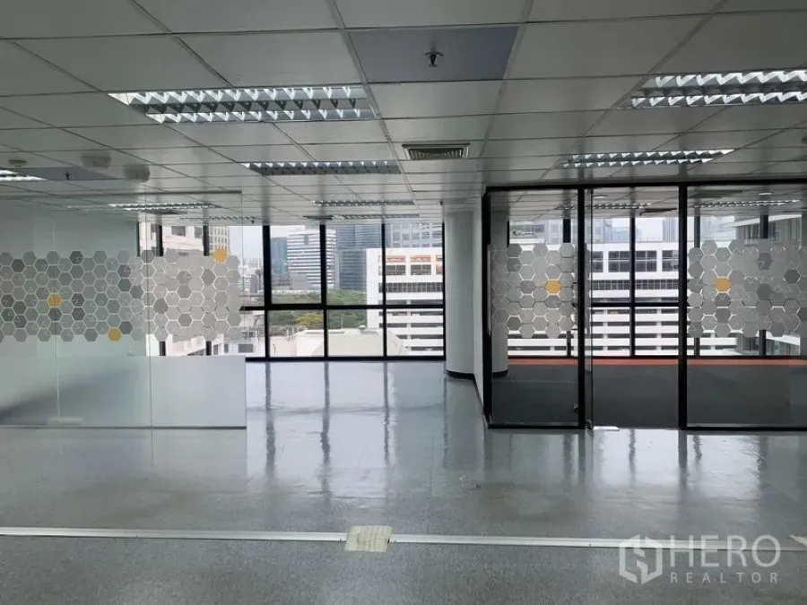 Office Space for rent in Bang Rak, Bangkok - Open-plan office with glass-partitioned meeting rooms and city skyline views.