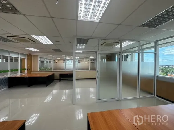 Office Space for rent in Suan Luang, Bangkok - Bright open-plan office with glass meeting room, frosted panels, large windows and tiled floors in Suan Luang, Bangkok.