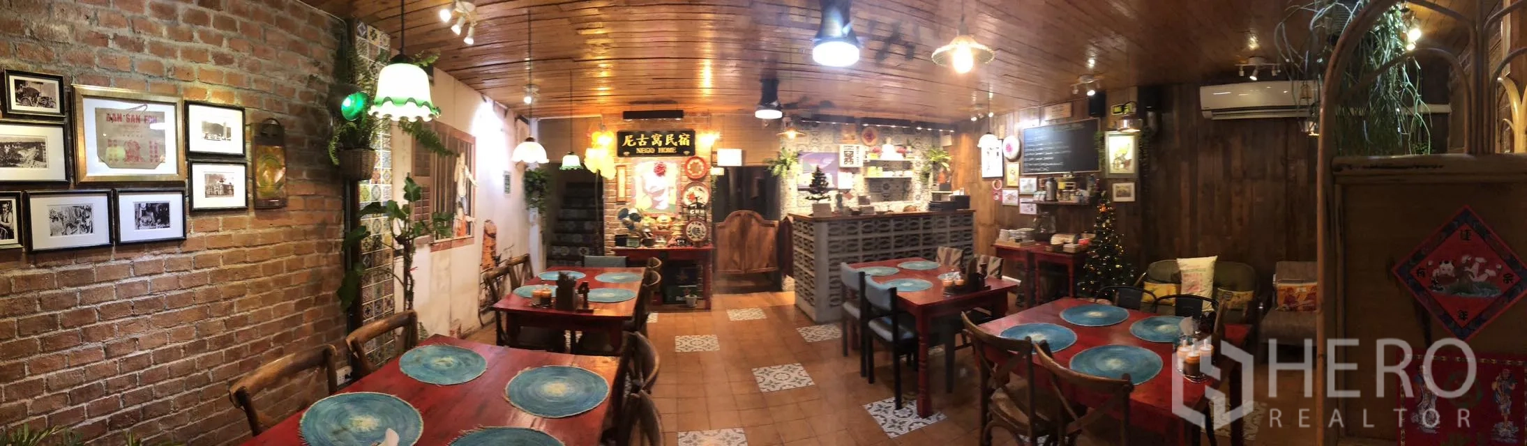 Retail Space for rent in Watthana, Bangkok - Panoramic view of a vintage-inspired dining room with wooden ceiling, pendant lights, and multiple tables.