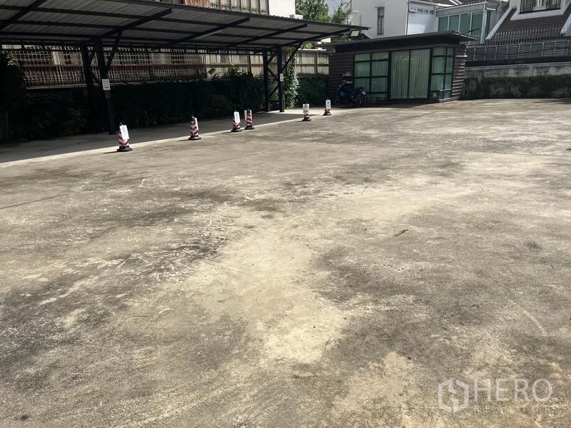 Retail Space for rent in Watthana, Bangkok - Spacious on-site parking area with covered bays in a gated compound.