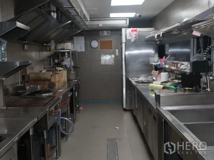 Retail Space for rent in Watthana, Bangkok - Stainless commercial kitchen line with hoods, counters, and sinks.