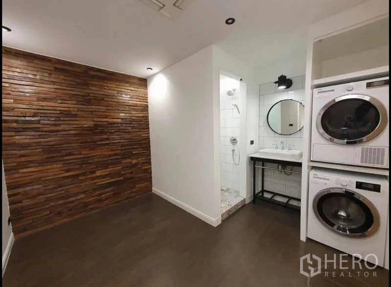 Condominium for rent in Watthana, Bangkok - Utility area with stacked washer and dryer, vanity and walk-in shower.