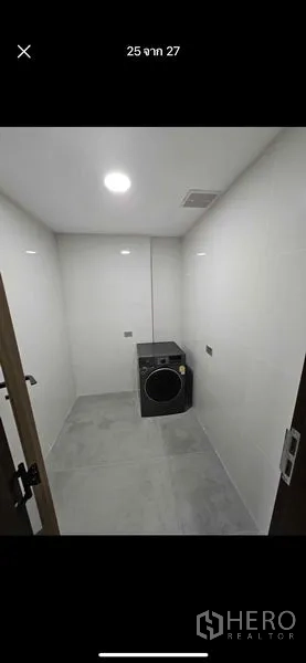 Condominium for rent or sale - Utility room with washing machine and tiled floor.