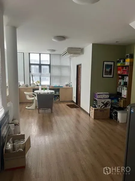 Retail Space for rent in Watthana, Bangkok - Spacious open-plan area with wooden floor, air conditioning, storage cabinets and seating.